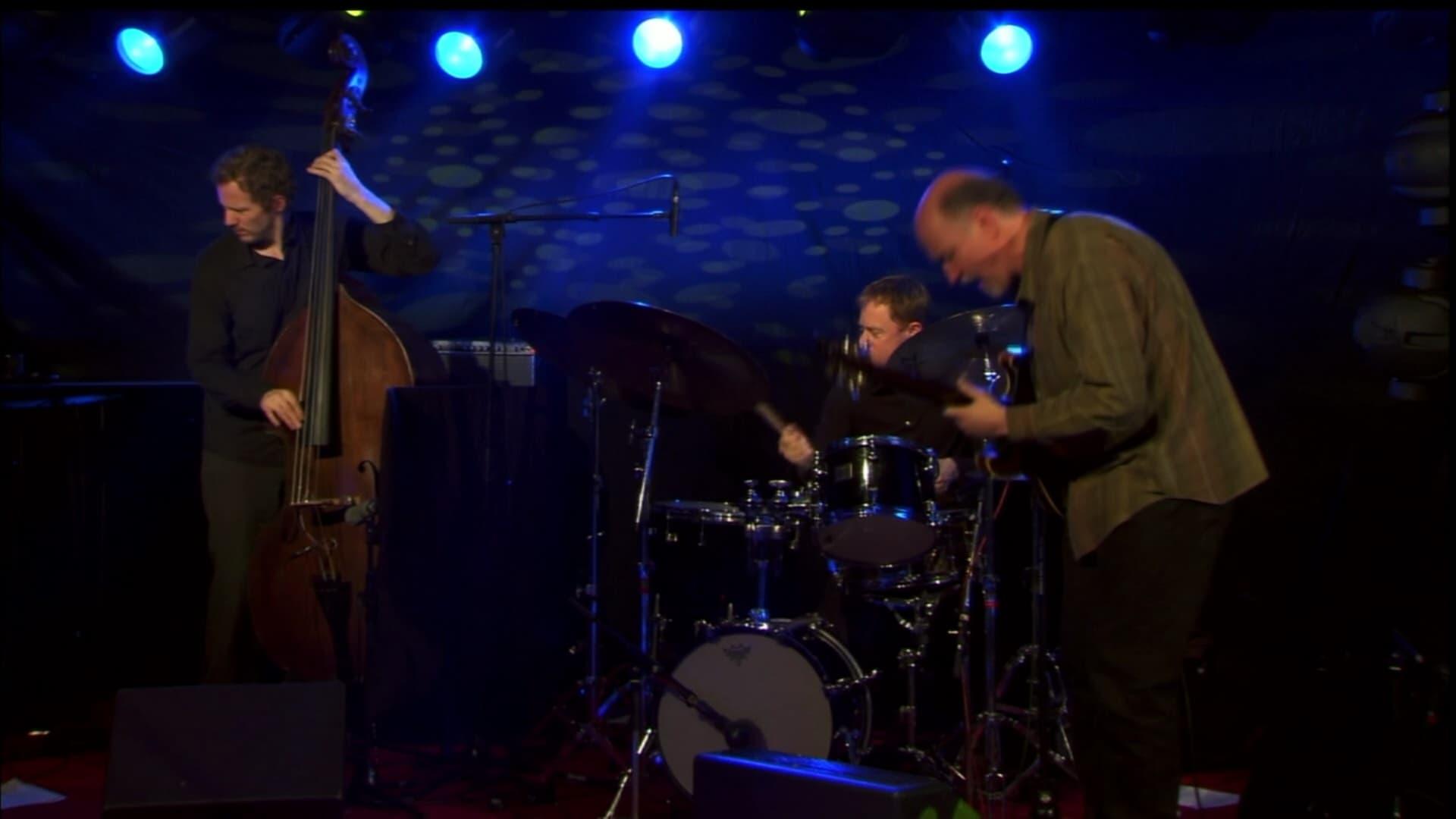 Backdrop for John Scofield: New Morning The Paris Concert